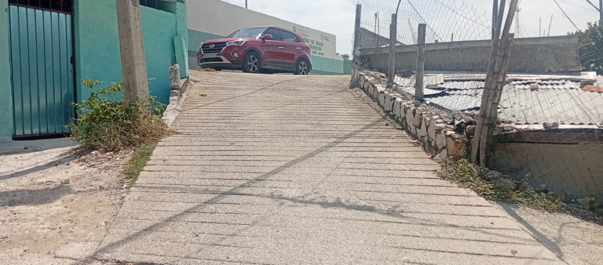 Pavimentación de calle sin nombre por el Centro de Salud, Lomas de San Juan